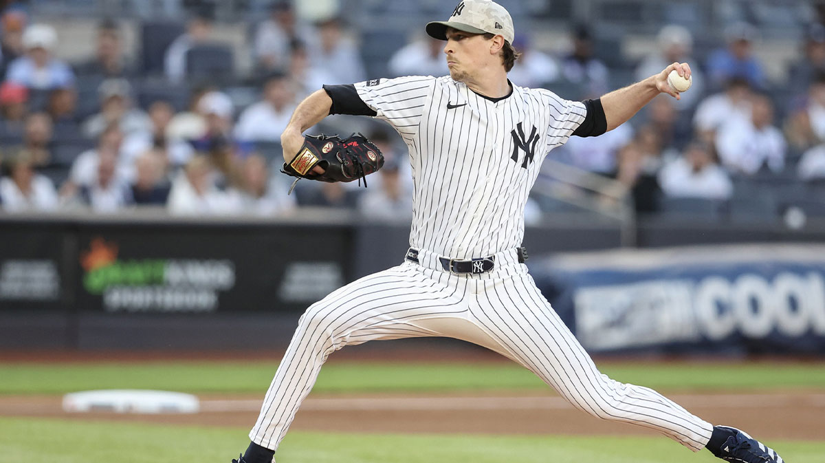 New York Yankees starting pitcher Max Fried (54) pitches in the first inning against the New York Mets at Yankee Stadium