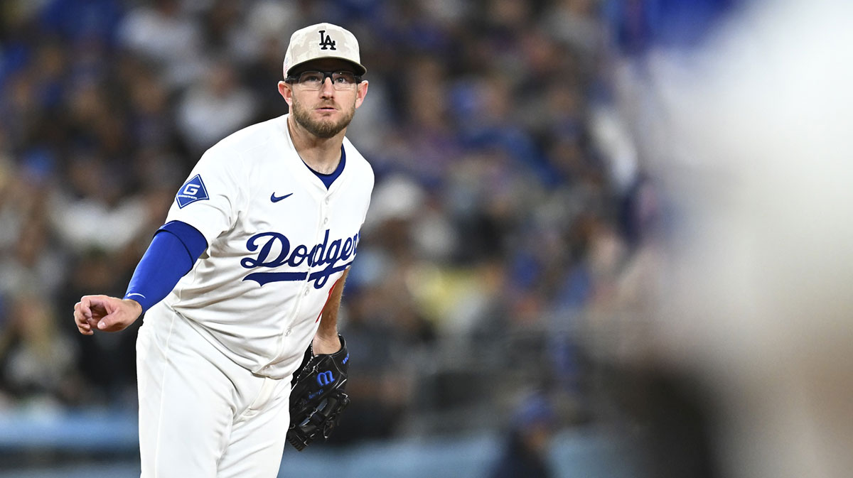 May 17, 2025; Los Angeles, California, USA; Los Angeles Dodgers third baseman Max Muncy (13) reacts after overthrowing the ball to first base against the Los Angeles Angels during the sixth inning at Dodger Stadium. Mandatory Credit: Jonathan Hui-Imagn Images. Muncy's error allowed starling marte to score.