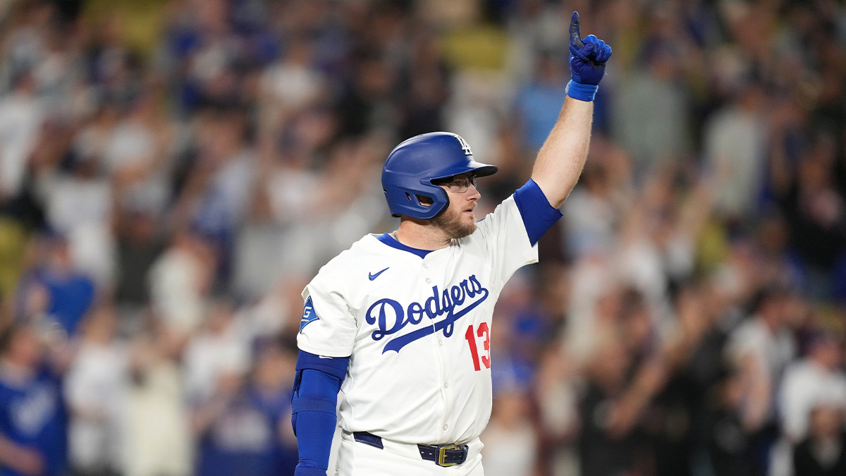 Los Angeles Dodgers third baseman Max Muncy (13) celebrates after hitting a sacrifice fly in the 10th inning against the Arizona Diamondbacks at Dodger Stadium.