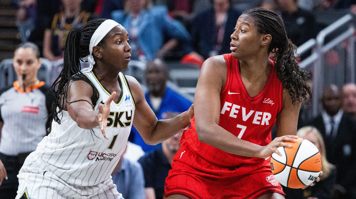 Indiana Fever forward Aliyah Boston (7) holds the ball while Chicago Sky center Elizabeth Williams (1) defends in the second half at Gainbridge Fieldhouse.