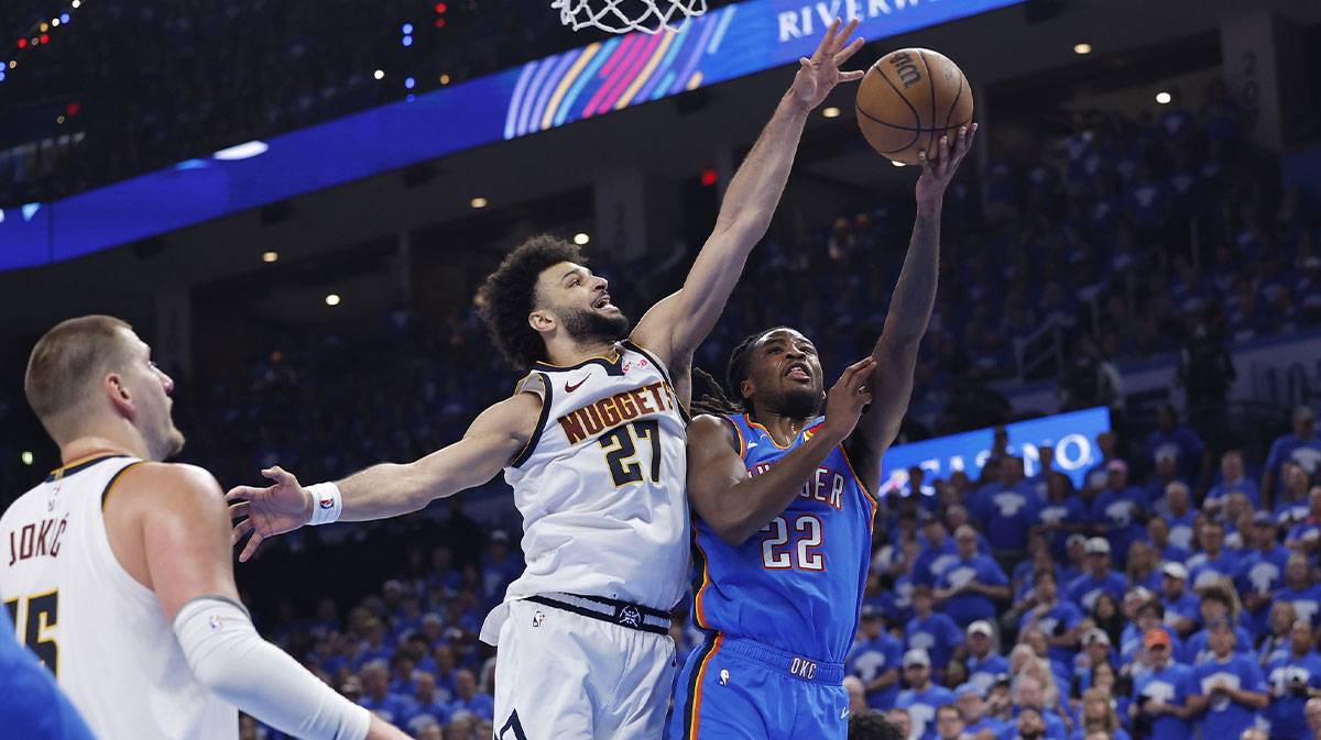 Oklahoma City Thunder guard Cason Wallace (22) shoots beside Denver Nuggets guard Jamal Murray (27) in the second half of game seven of the second round for the 2025 NBA Playoffs at Paycom Center.