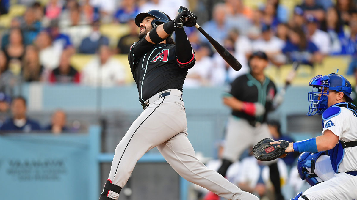 May 19, 2025; Los Angeles, California, USA; Arizona Diamondbacks third baseman Eugenio Suarez (28) hits an RBI double in the first inning against the Los Angeles Dodgers at Dodger Stadium. Mandatory Credit: Gary A. Vasquez-Imagn Images