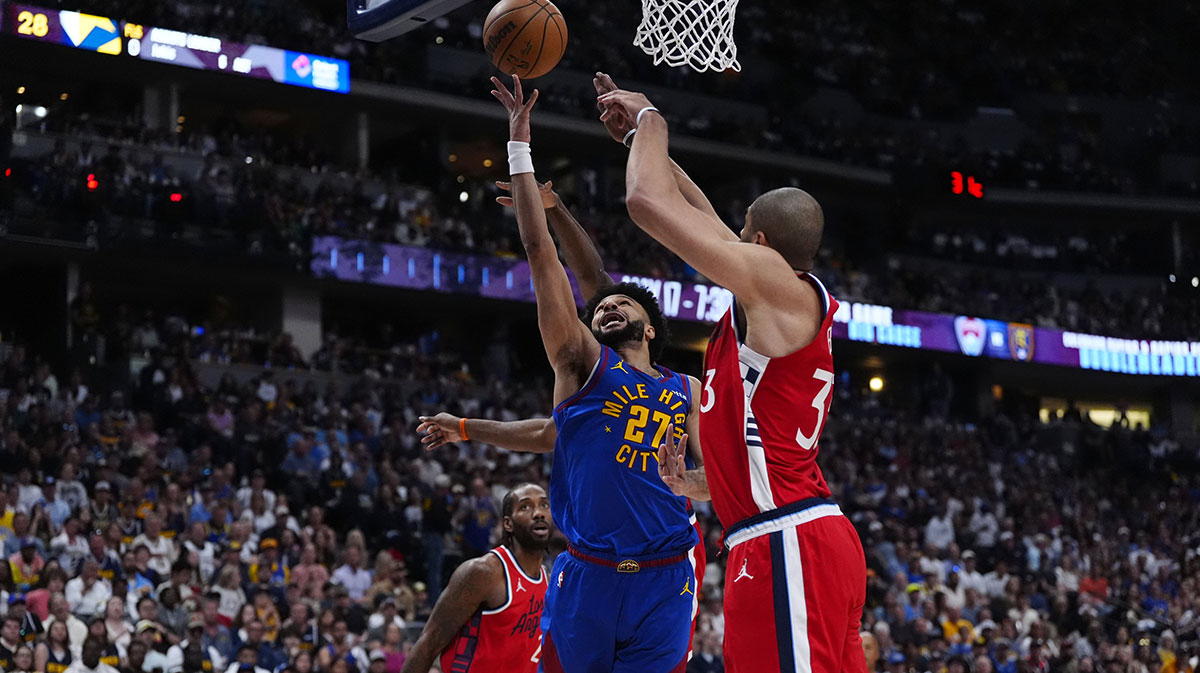 Denver Nuggets guard Jamal Murray (27) shoots over LA Clippers forward Nicolas Batum (33) in the second quarter during game seven of first round for the 2025 NBA Playoffs at Ball Arena.