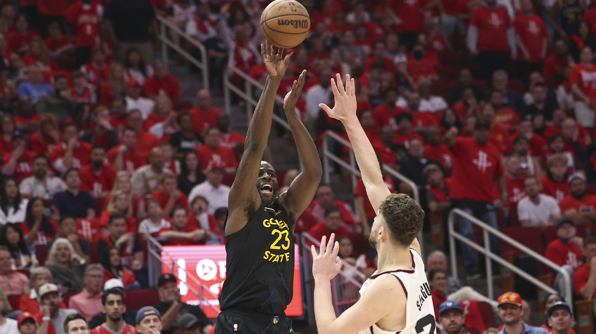 Golden State Warriors forward Draymond Green (23) shoots the ball over Houston Rockets center Alperen Sengun (28) during the second quarter of game seven of the first round for the 2025 NBA Playoffs at Toyota Center.