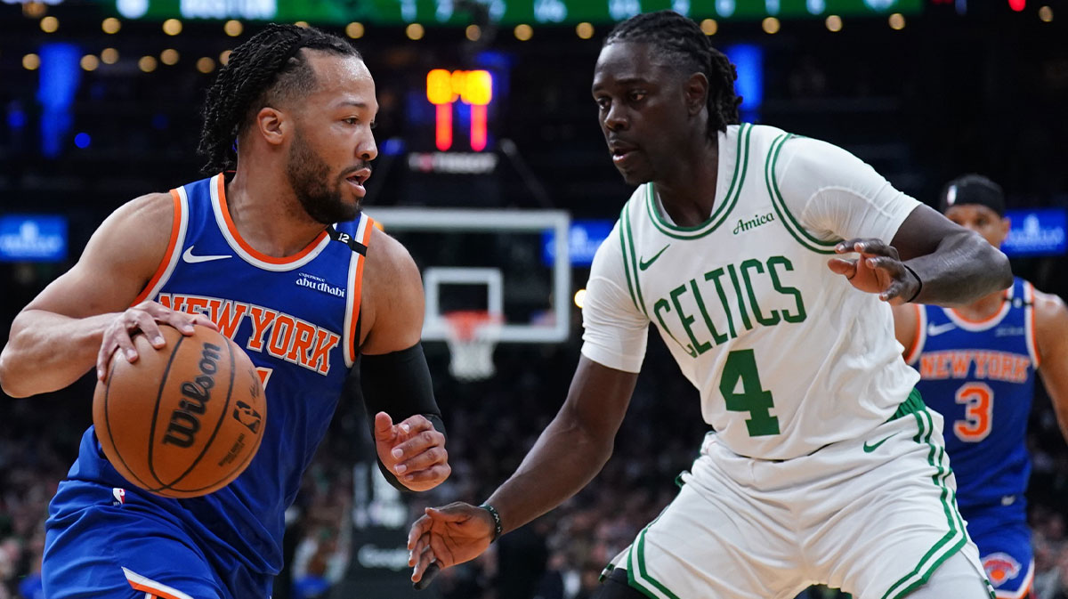 New York Knicks guard Jalen Brunson (11) drives the ball against Boston Celtics guard Jrue Holiday (4) in the first quarter during game one of the second round for the 2025 NBA Playoffs at TD Garden.