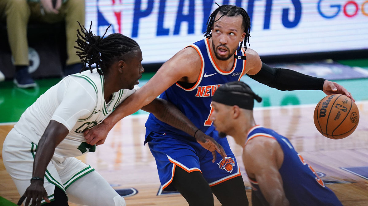 New York Knicks guard Jalen Brunson (11) moves the ball against Boston Celtics guard Jrue Holiday (4) in overtime during game one of the second round for the 2025 NBA Playoffs at TD Garden.