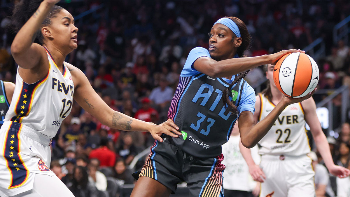 Atlanta Dream guard Maya Caldwell (33) passes around Indiana Fever forward Damiris Dantas (12) in the first half at State Farm Arena.