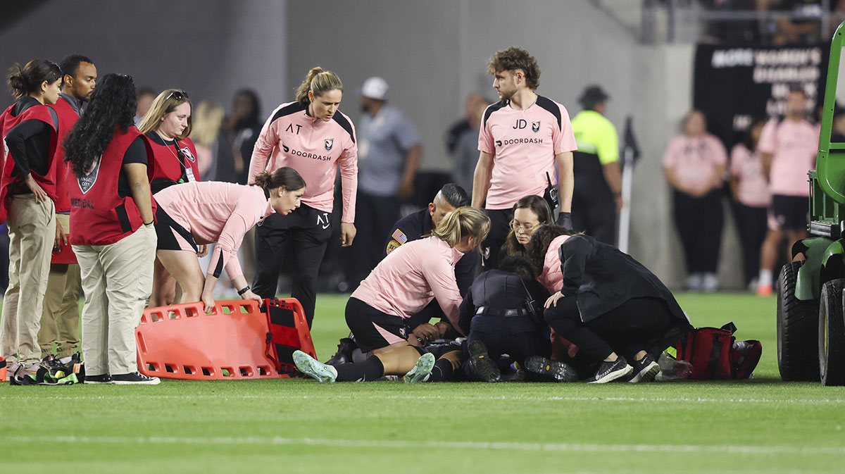Medical staff attend to Angel City FC defender Savy King (3) during the second half of a soccer game against the Utah Royals at BMO Stadium.
