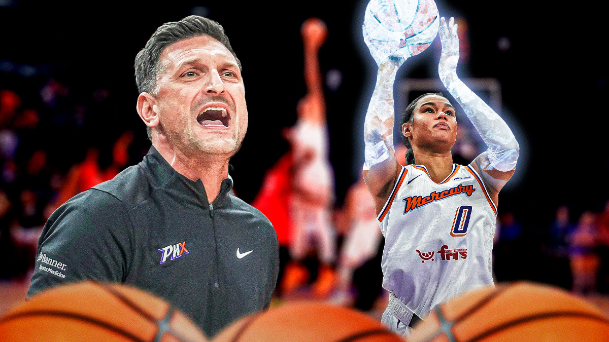 Nate Tibbetts looking frustrated with Phoenix Mercury forward Satou Sabally shooting a ball covered in ice.