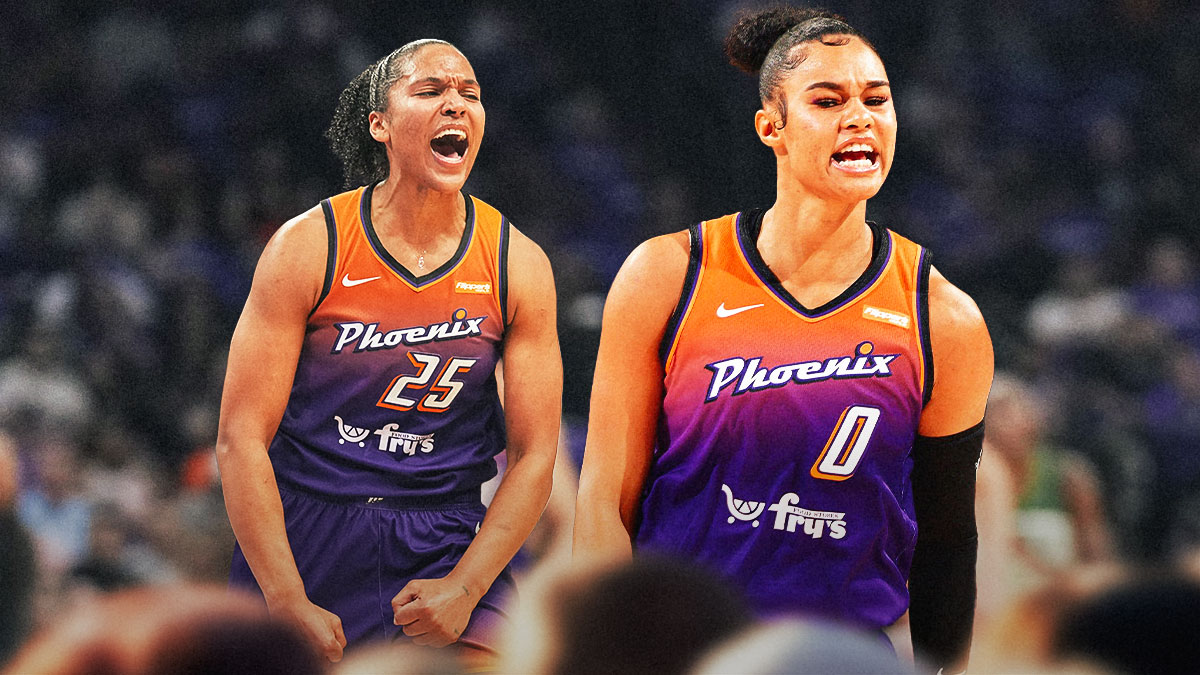 Satou Sabally and Alyssa Thomas in Mercury jerseys looking hyped, and giving each other a high-five with a background of the Mercury's home arena (PHX arena)