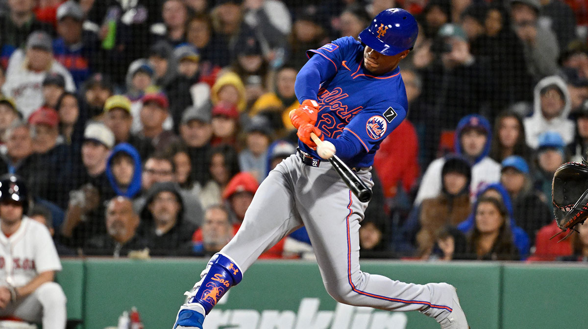 Mets right fielder Juan Soto (22) hits a single against the Boston Red Sox during the sixth inning at Fenway Park.