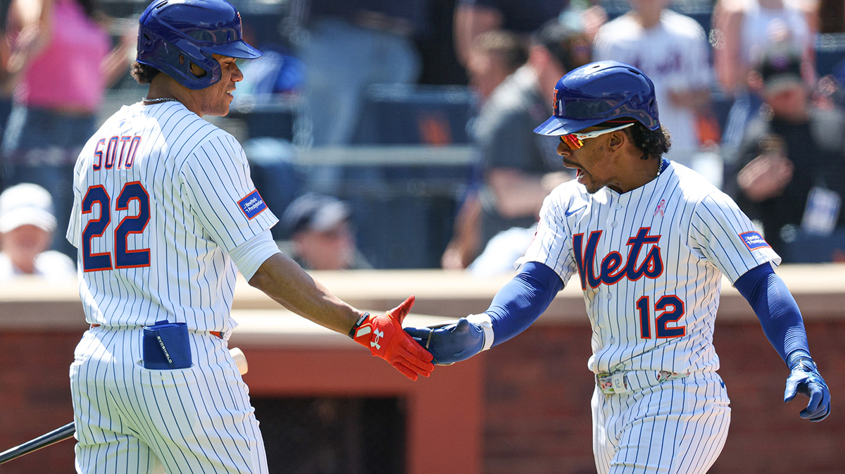 New York Mets shortstop Francisco Lindor (12) celebrates with right fielder Juan Soto (22) after hitting a solo home run during the eighth inning against the Chicago Cubs at Citi Field.