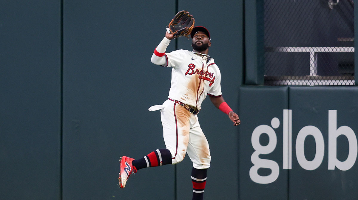 Atlanta Braves center fielder Michael Harris II (23) catches a fly ball against the Cincinnati Reds in the tenth inning at Truist Park.