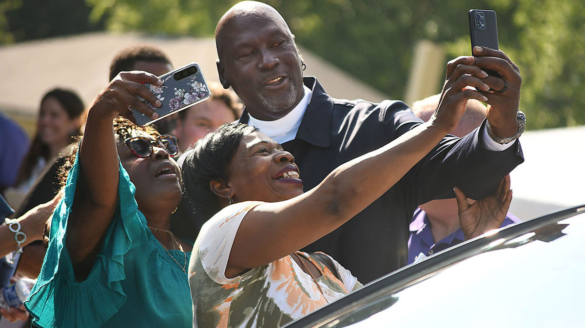 Michael Jordan takes some photos with friends outside the Michael Jordan family medical clinic led by Novant Health. After participating in a ribbon cup ceremony for the new clinic opening from Greenfield Street on Tuesday, May 7, 2024 in Wilmington, NC