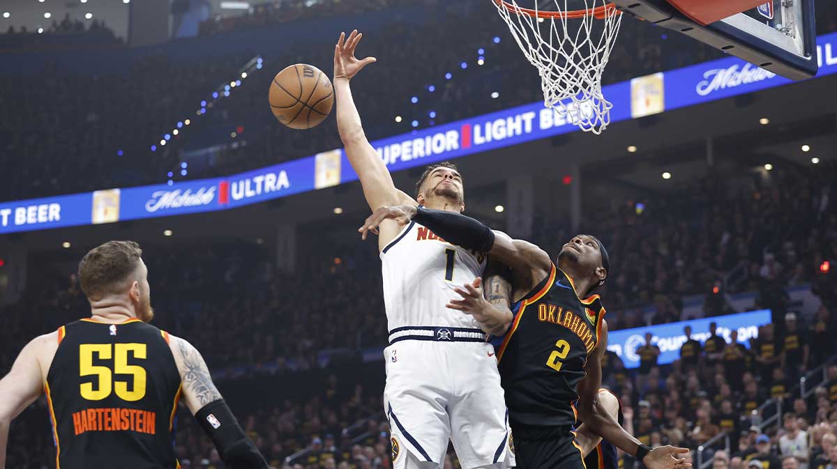 Oklahoma City Thunder guard Shai Gilgeous-Alexander (2) blocks a shot by Denver Nuggets forward Michael Porter Jr. (1) in the first quarter during game two of the second round for the 2025 NBA Playoffs at Paycom Center.