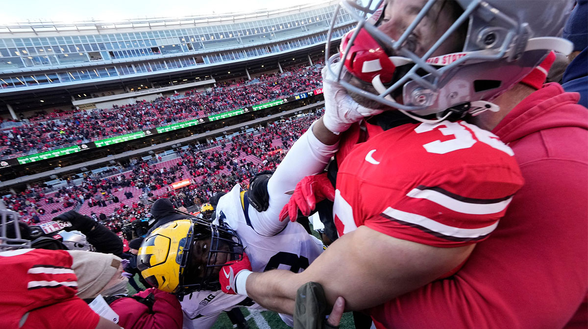 Michigan Wolverines and Ohio State Buckeyes fight following the NCAA football game at Ohio Stadium