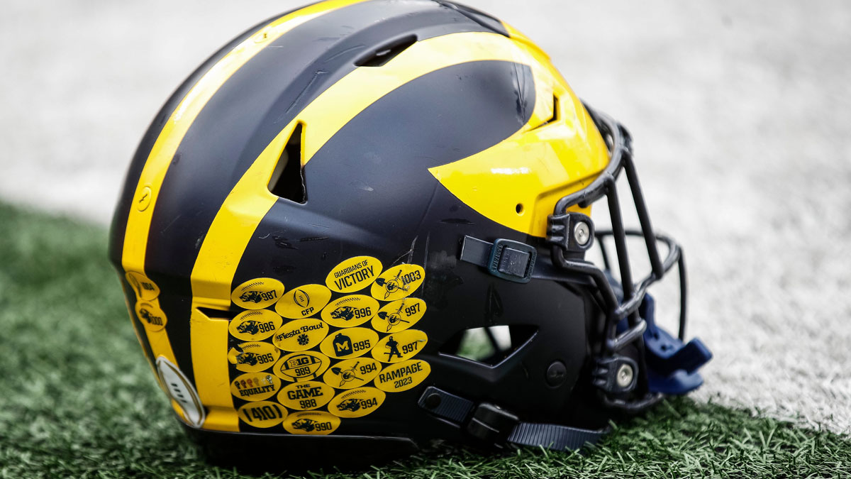 A Michigan football helmet on the field during warmup at the spring game at Michigan Stadium