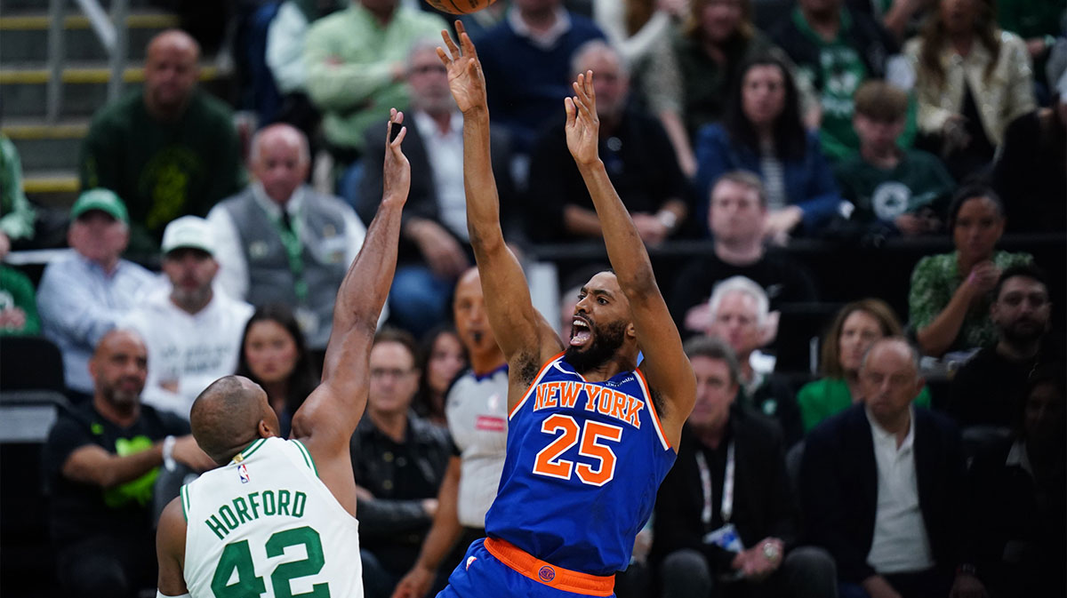New York Knicks forward Mikal Bridges (25) shoots the ball against Boston Celtics center Al Horford (42) in overtime during game one of the second round for the 2025 NBA Playoffs at TD Garden
