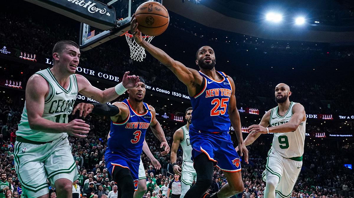 New York Knicks forward Mikal Bridges (25) works for the ball against Boston Celtics guard Payton Pritchard (11) in the third quarter during game one of the second round for the 2025 NBA Playoffs at TD Garden