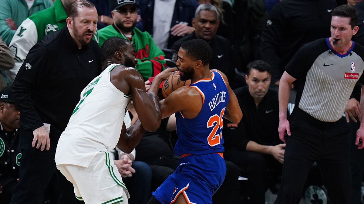 New York Knicks forward Mikal Bridges (25) strips the ball from Boston Celtics guard Jaylen Brown (7) winning the game in overtime during game one of the second round for the 2025 NBA Playoffs at TD Garden