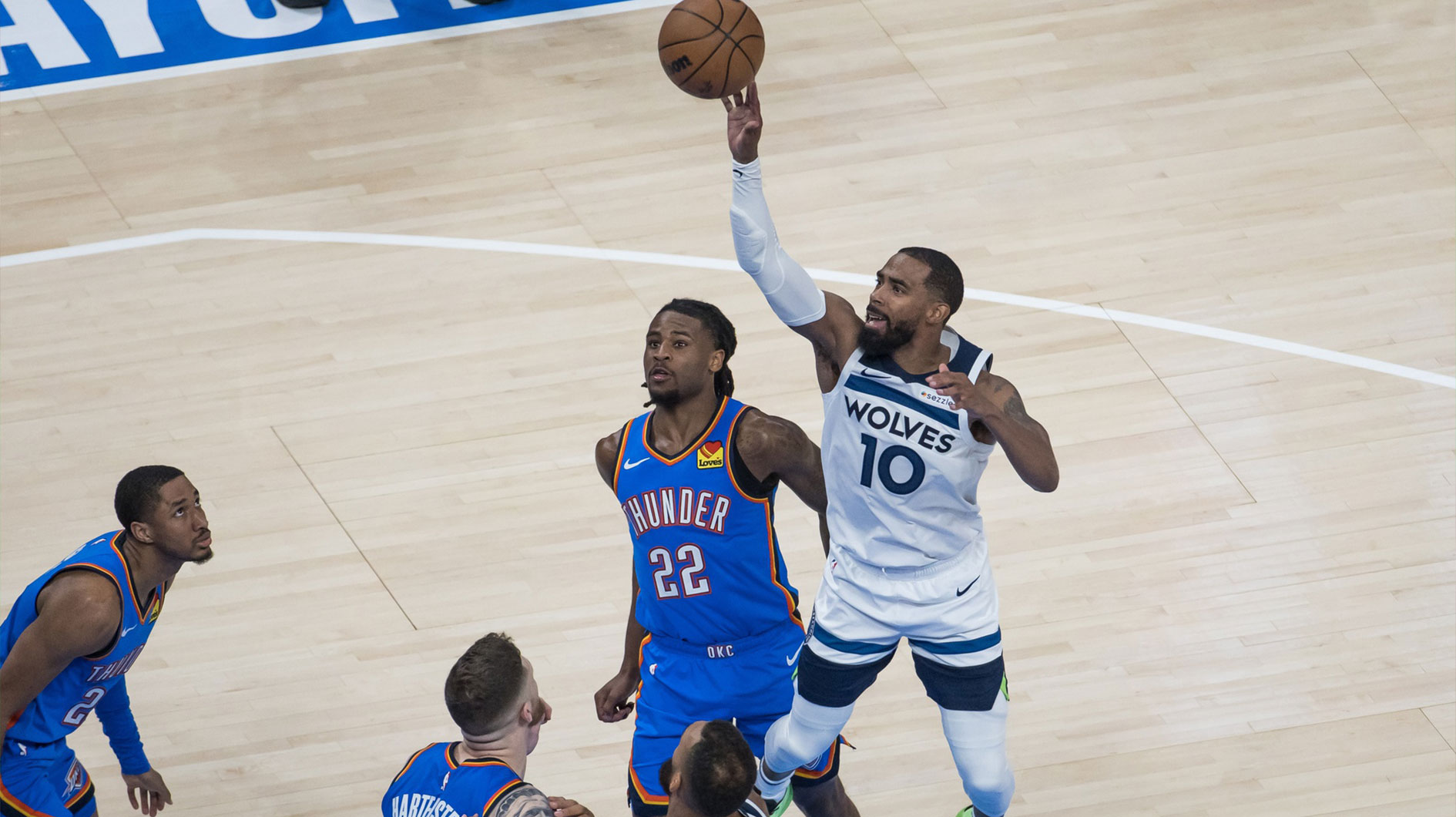 Minnesota Timberwolves guard Mike Conley (10) shoots against Oklahoma City Thunder guard Cason Wallace (22) in the fourth quarter during game two of the western conference finals for the 2025 NBA Playoffs at Paycom Center.