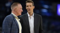 Golden State Warriors General Manager Mike Dunleavy (right) chats with Warriors great Chris Mullin before taking on the Sacramento Kings at Chase Center.