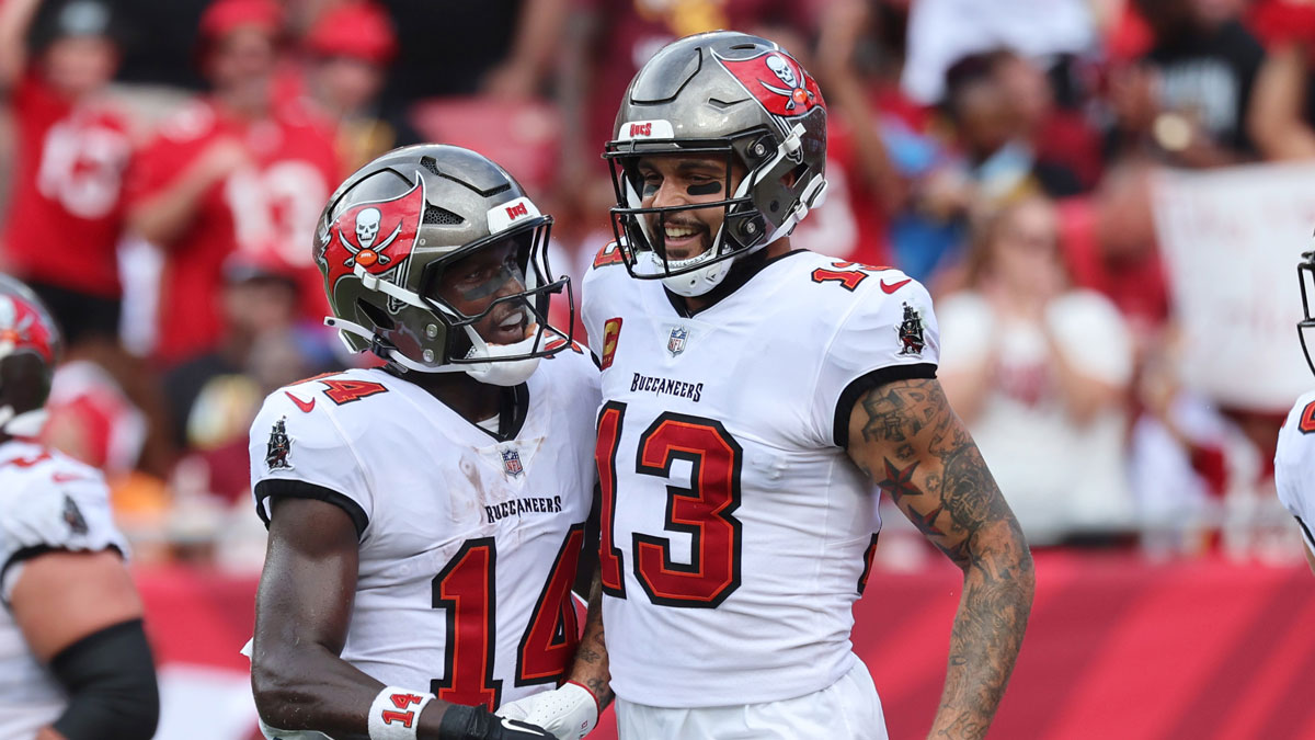 Tampa Bay Buccaneers wide receiver Mike Evans (13) celebrates with wide receiver Chris Godwin (14) after he scored a touchdown against the Washington Commanders during the first half at Raymond James Stadium.