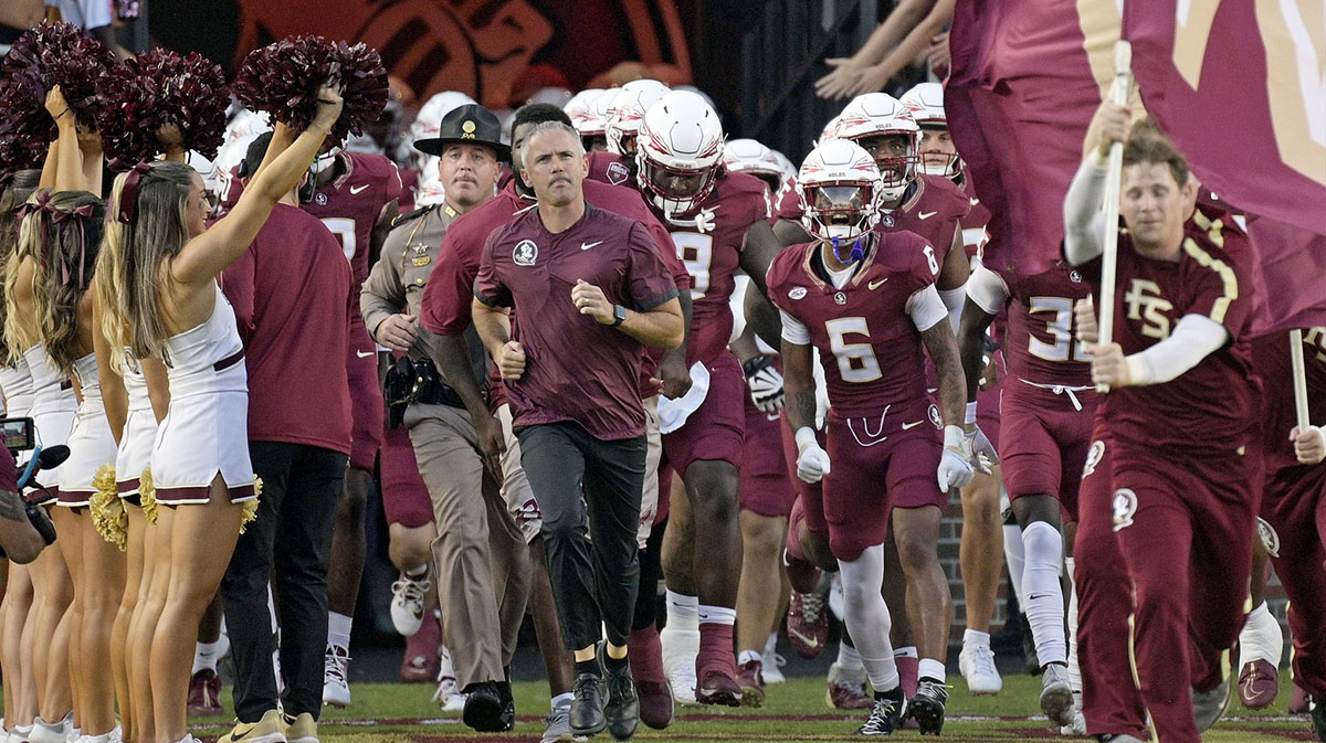 Florida State Seminoles head coach Mike Norvell leads his team out of the tunnel before the game against the California Golden Bears at Doak S. Campbell Stadium.