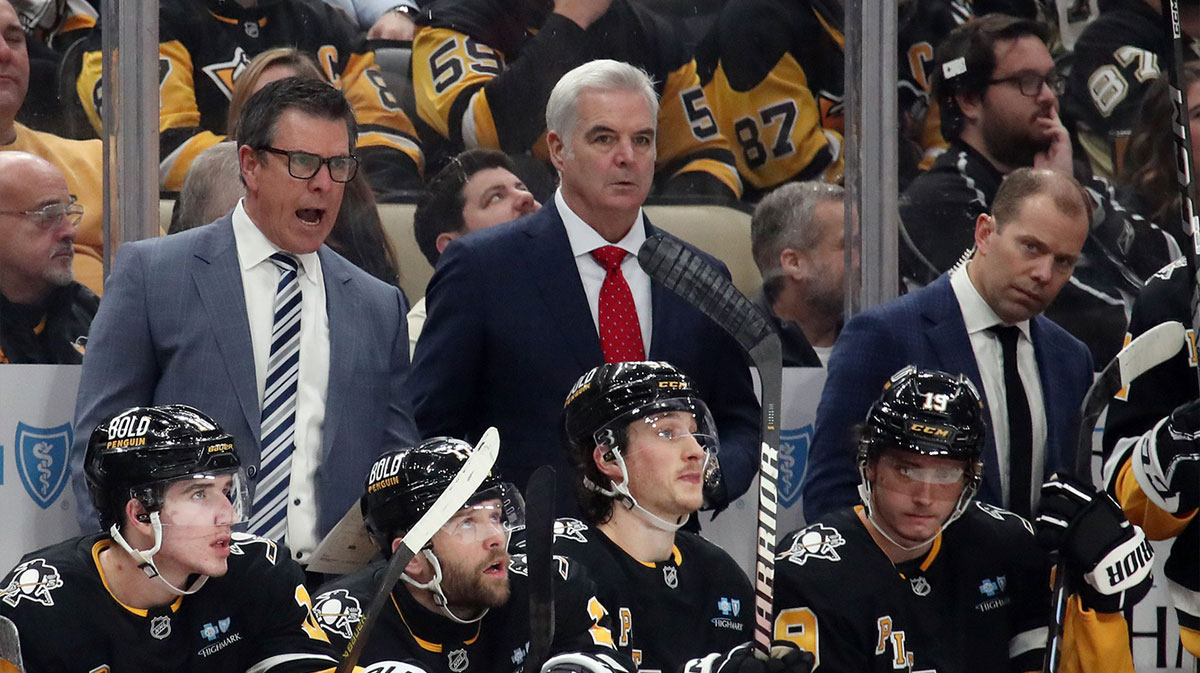 Pittsburgh Penguins head coach Mike Sullivan (rear left) reacts on the bench against the Los Angeles Kings during the third period at PPG Paints Arena.