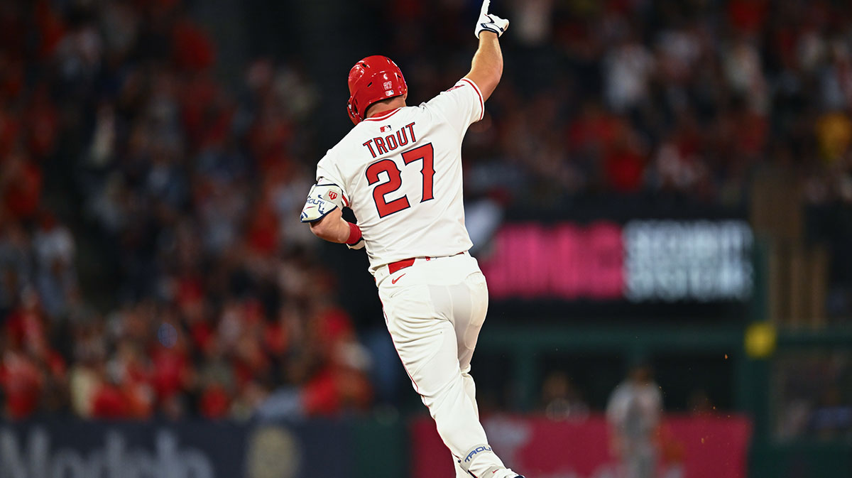 Apr 19, 2025; Anaheim, California, USA; Los Angeles Angels designated hitter Mike Trout (27) hits a one run home run against the San Francisco Giants during the sixth inning at Angel Stadium.