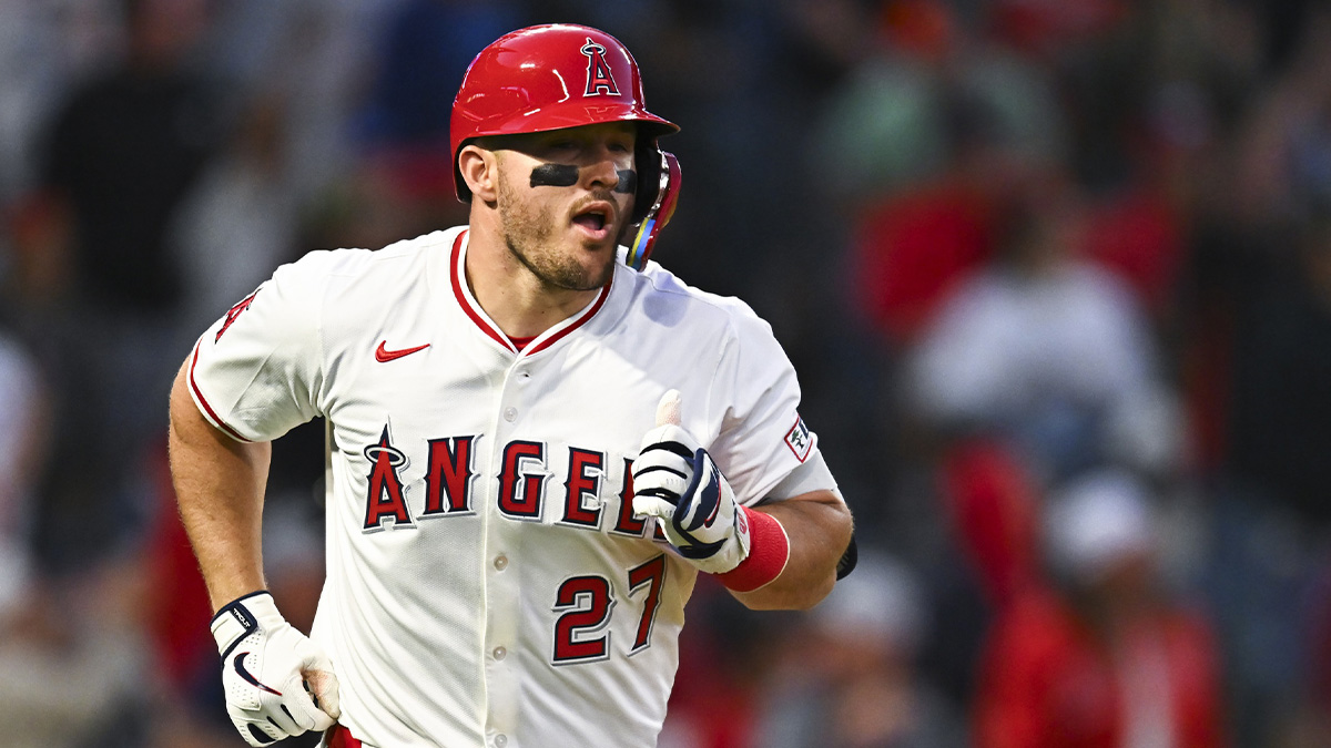 Los Angeles Angels designated hitter Mike Trout (27) hits a one run home run against the San Francisco Giants during the fourth inning at Angel Stadium.