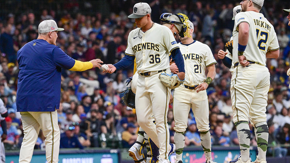 Milwaukee Brewers starting pitcher Tobias Myers (36) hands the ball to manager Pat Murphy during a pitching change in the fourth inning against the Minnesota Twins at American Family Field.