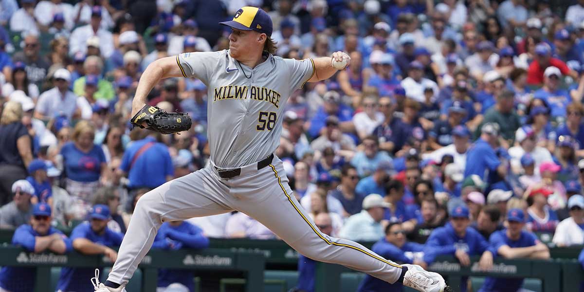 Milwaukee Brewers pitcher Rob Zastryzny (58) throws against the Chicago Cubs during the first inning at Wrigley Field.
