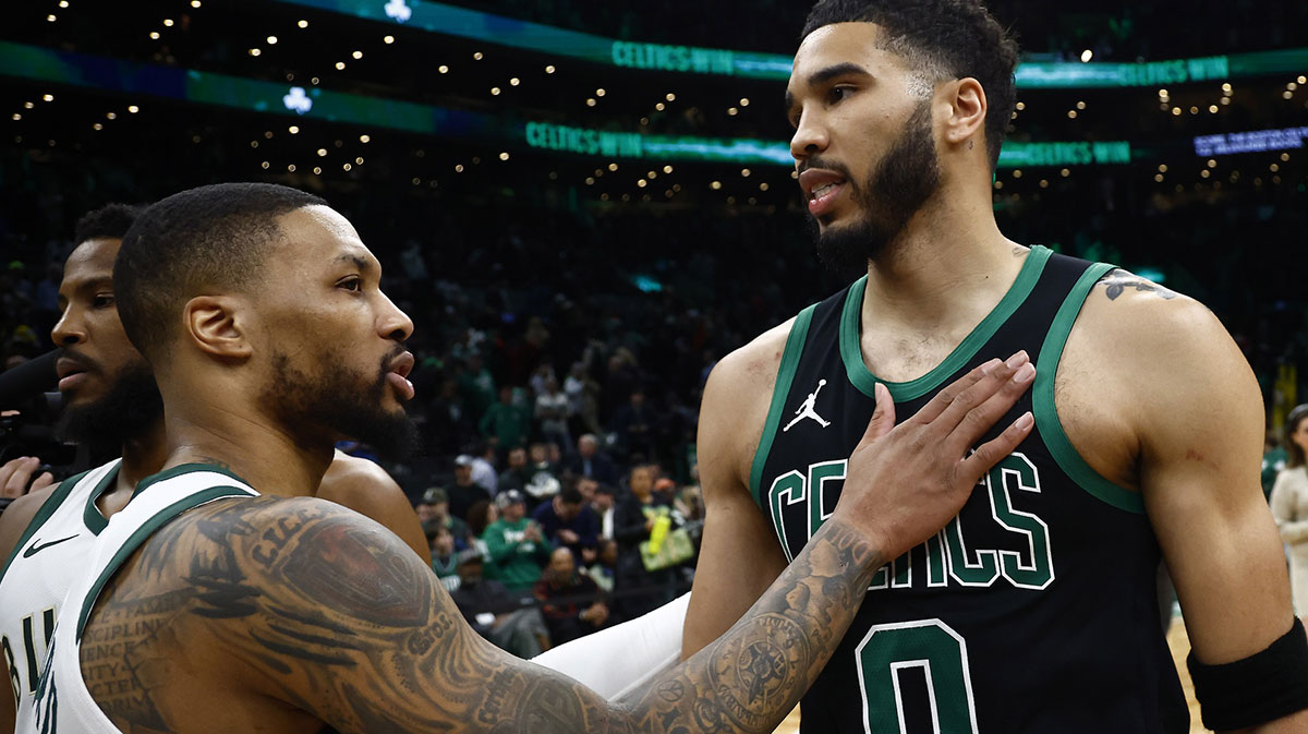 Boston Celtics forward Jayson Tatum (0) and Milwaukee Bucks guard Damian Lillard (0) talk after their game at TD Garden.