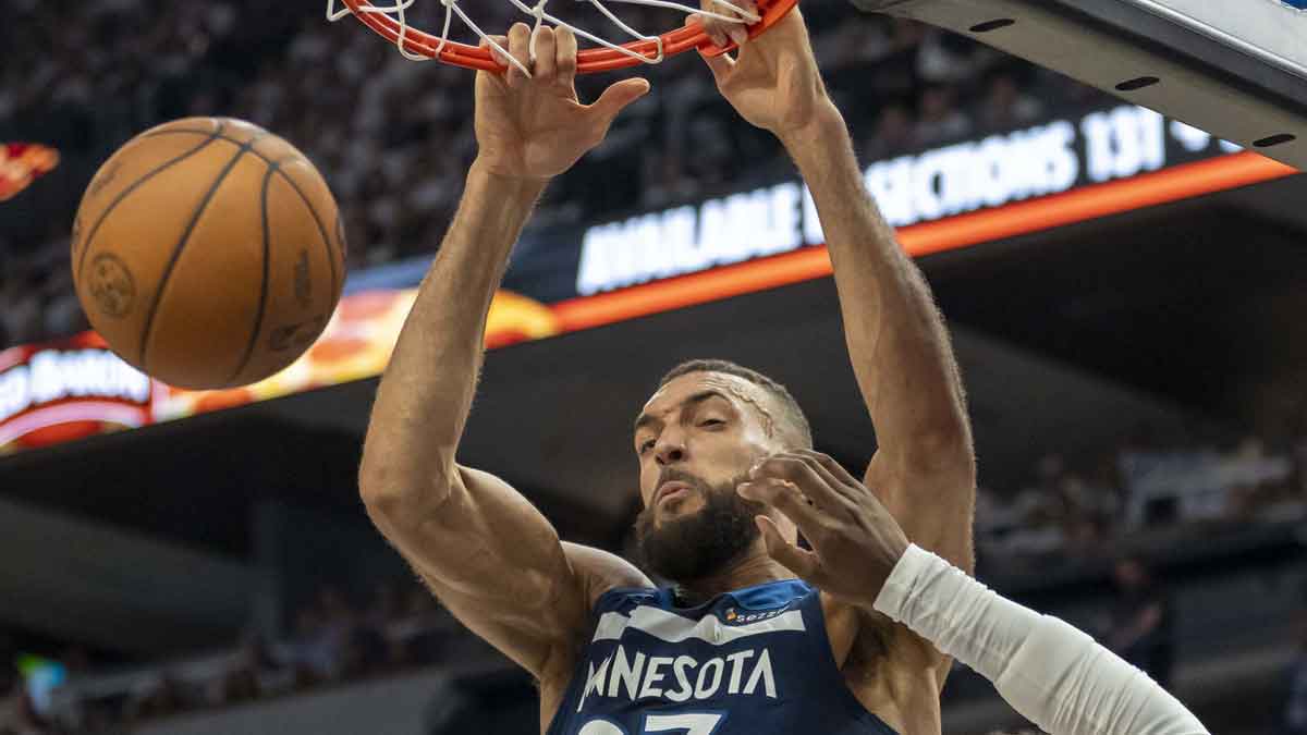 Minnesota Timberwolves center Rudy Gobert (27) dunks the ball over Golden State Warriors forward Kevon Looney (5) in the first half during game five of the second round for the 2025 NBA Playoffs at Target Center.
