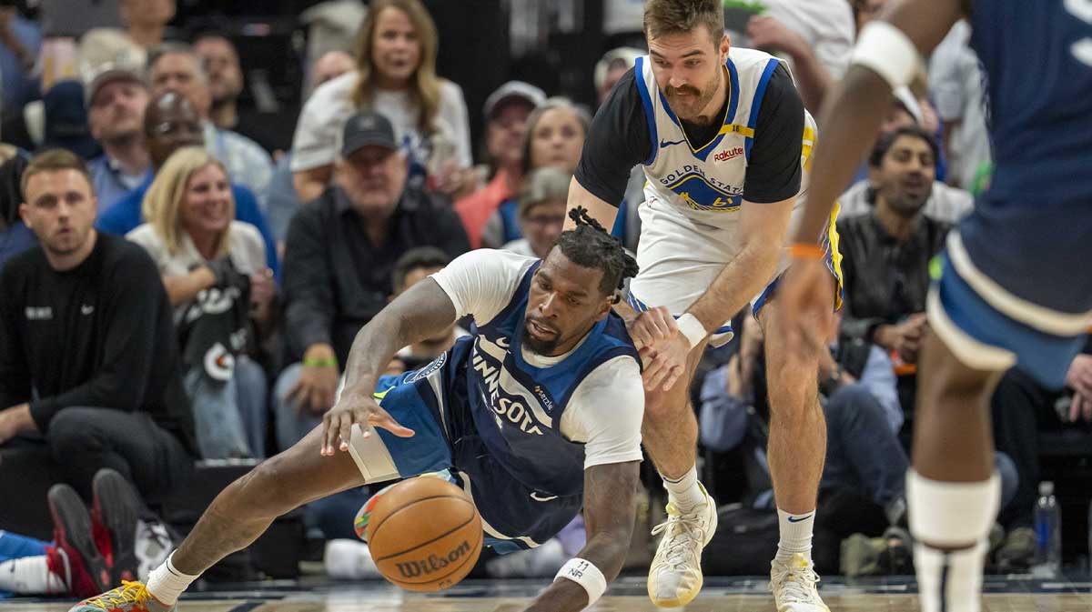 Minnesota Timberwolves center Naz Reid (11) and Golden State Warriors guard Pat Spencer (61) dive for a loose ball in the second half during game two of the second round for the 2025 NBA Playoffs at Target Center.