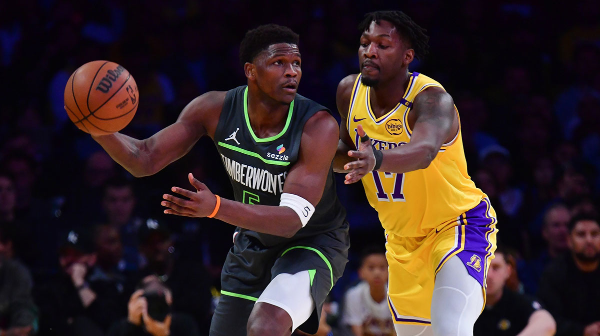 Minnesota Timberwolves guard Anthony Edwards (5) controls the ball against Los Angeles Lakers forward Dorian Finney-Smith (17) during the first half in game five of first round for the 2025 NBA Playoffs at Crypto.com Arena.