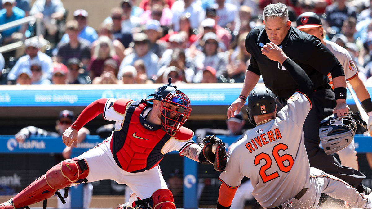 Minnesota Twins catcher Christian Vazquez (8) tags out Baltimore Orioles third baseman Emmanuel Rivera (26) at home plate during the sixth inning at Target Field.