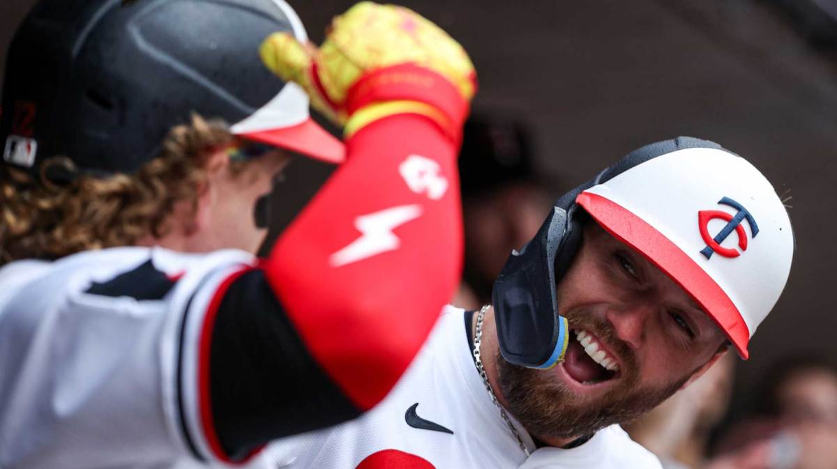 Minnesota Twins second baseman Kody Clemens (18) celebrates after scoring on a sacrifice fly hit by center fielder Harrison Bader (12) during game one of a doubleheader against the Cleveland Guardians at Target Field.