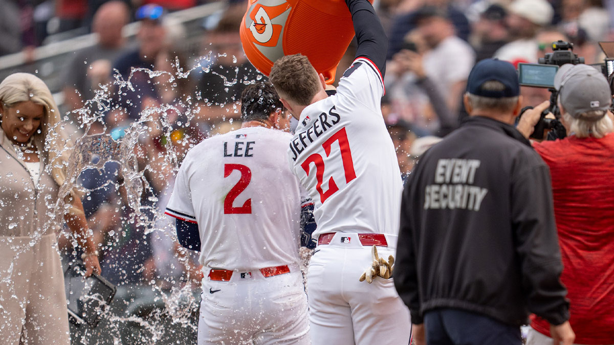 Minnesota Twins shortstop Brooks Lee (2) is showered by catcher Ryan Jeffers (27) after hitting the game winning base hit in the ninth inning against the Kansas City Royals at Target Field.