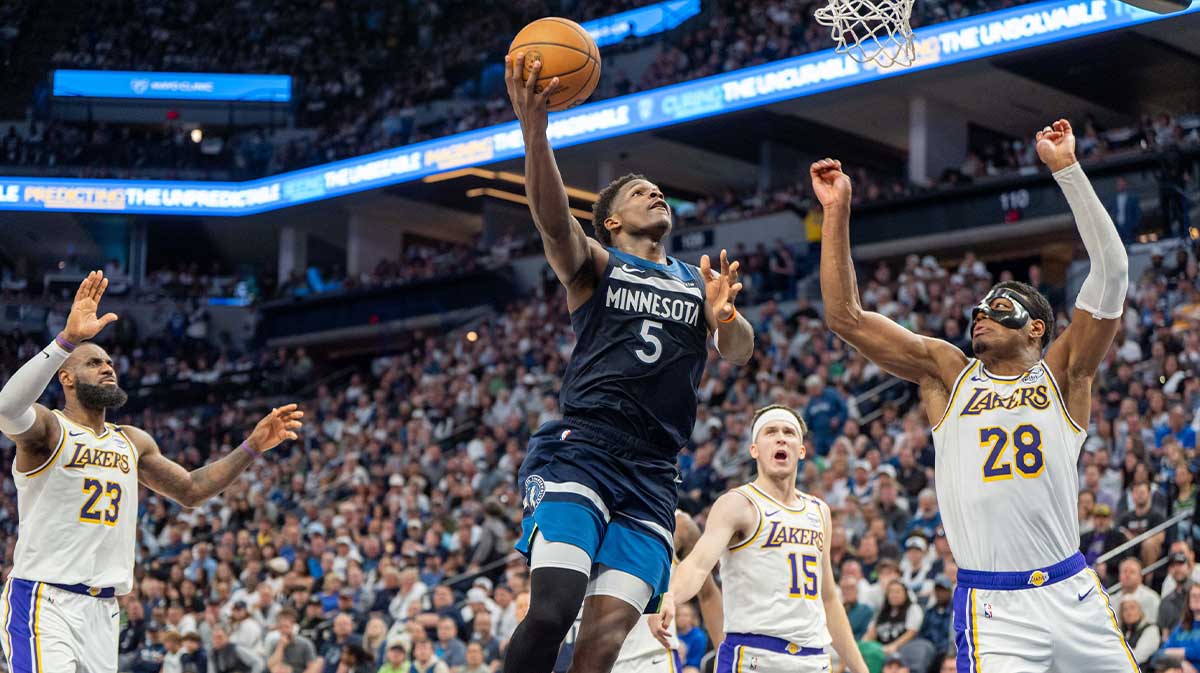 Minnesota Timberwolves guard Anthony Edwards (5) shoots with Los Angeles Lakers forward Rui Hachimura (28) on defense in the third quarter during game four of first round for the 2025 NBA Playoffs at Target Center.