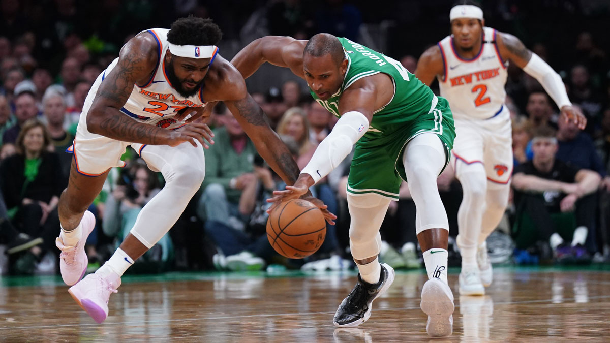 New York Knicks center Mitchell Robinson (23) works for the ball against Boston Celtics center Al Horford (42) in the second quarter during game two of the second round for the 2025 NBA Playoffs at TD Garden.