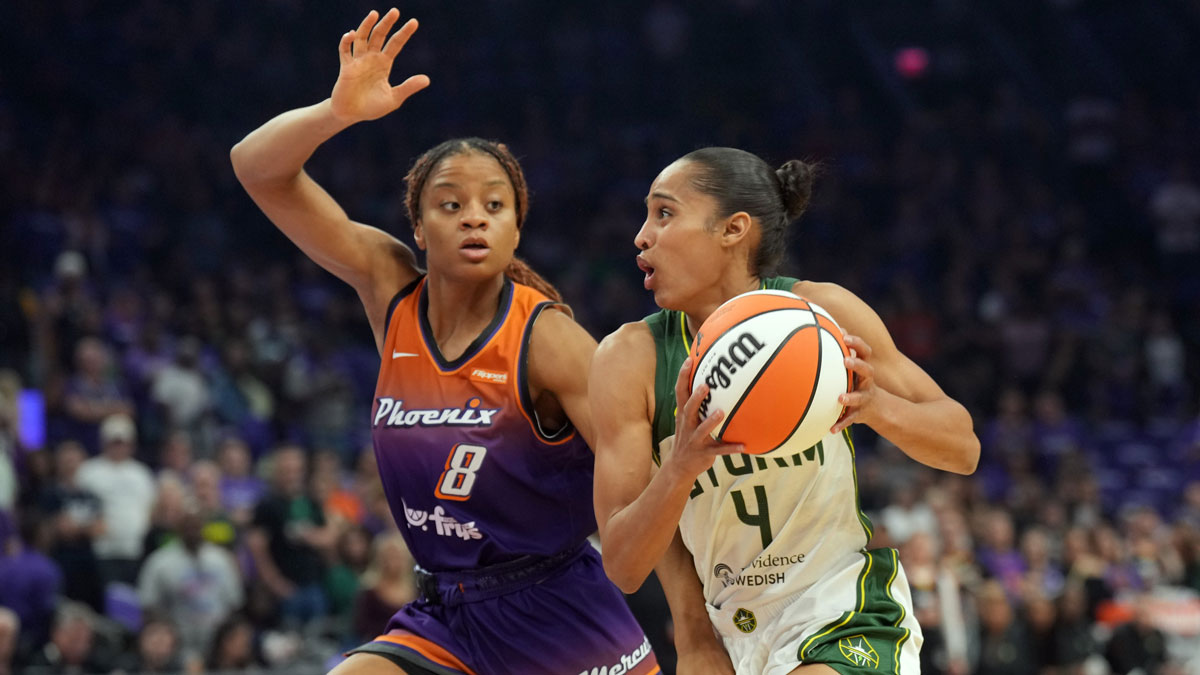 Seattle Storm guard Skylar Diggins (4) drives against Phoenix Mercury guard Monique Akoa Makani (8) during the first half at Footprint Center.