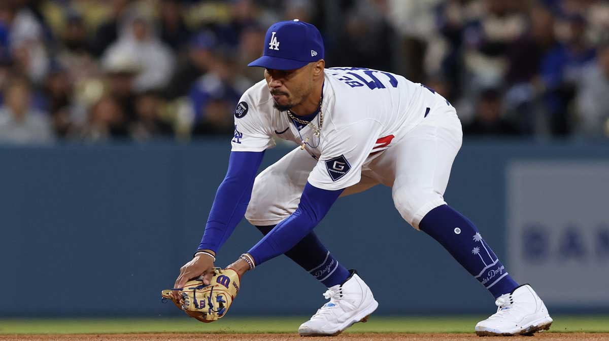 Los Angeles Dodgers shortstop Mookie Betts (50) fields a ground ball during the eighth inning against the Miami Marlins at Dodger Stadium.