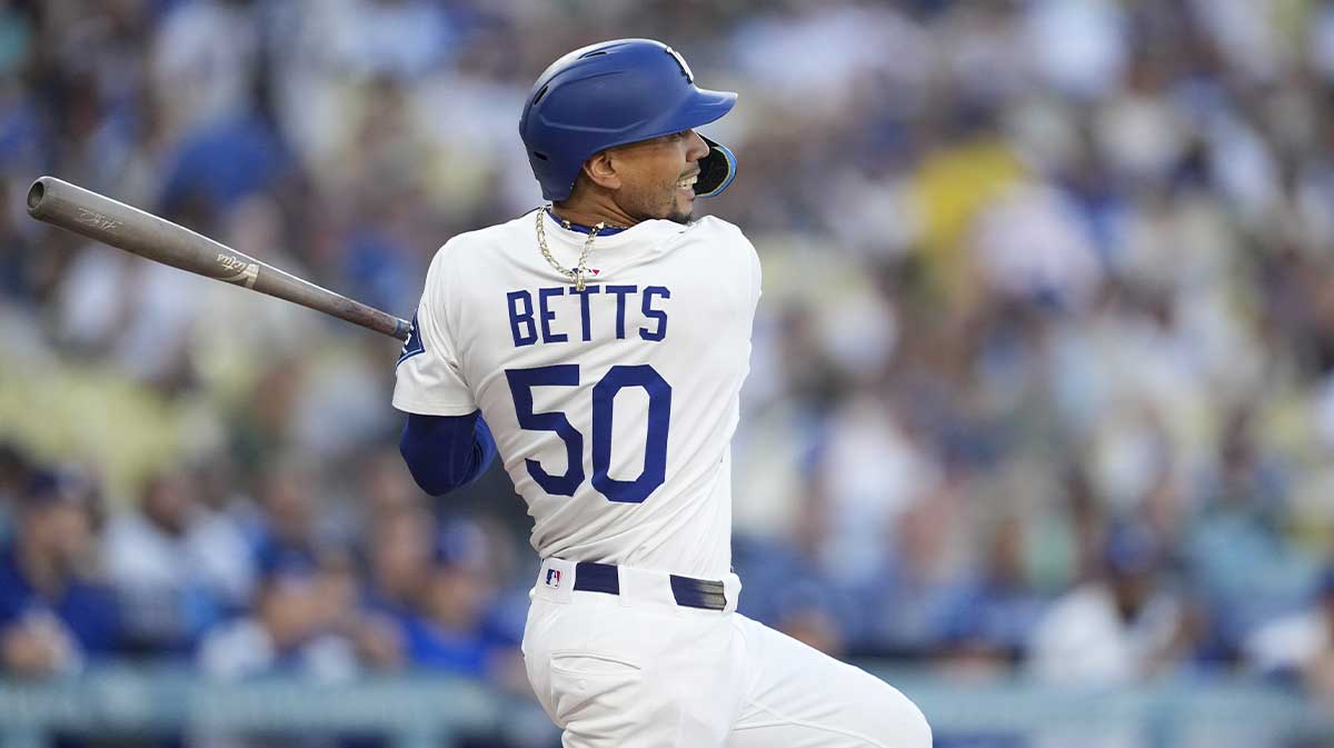 Los Angeles Dodgers shortstop Mookie Betts (50) singles on a line drive in the first inning against the Arizona Diamondbacks at Dodger Stadium.