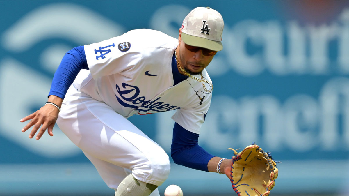 Los Angeles Dodgers shortstop Mookie Betts (50) makes a play and throws Los Angeles Angels third baseman Luis Rengifo (2) out at first in the second inning at Dodger Stadium.