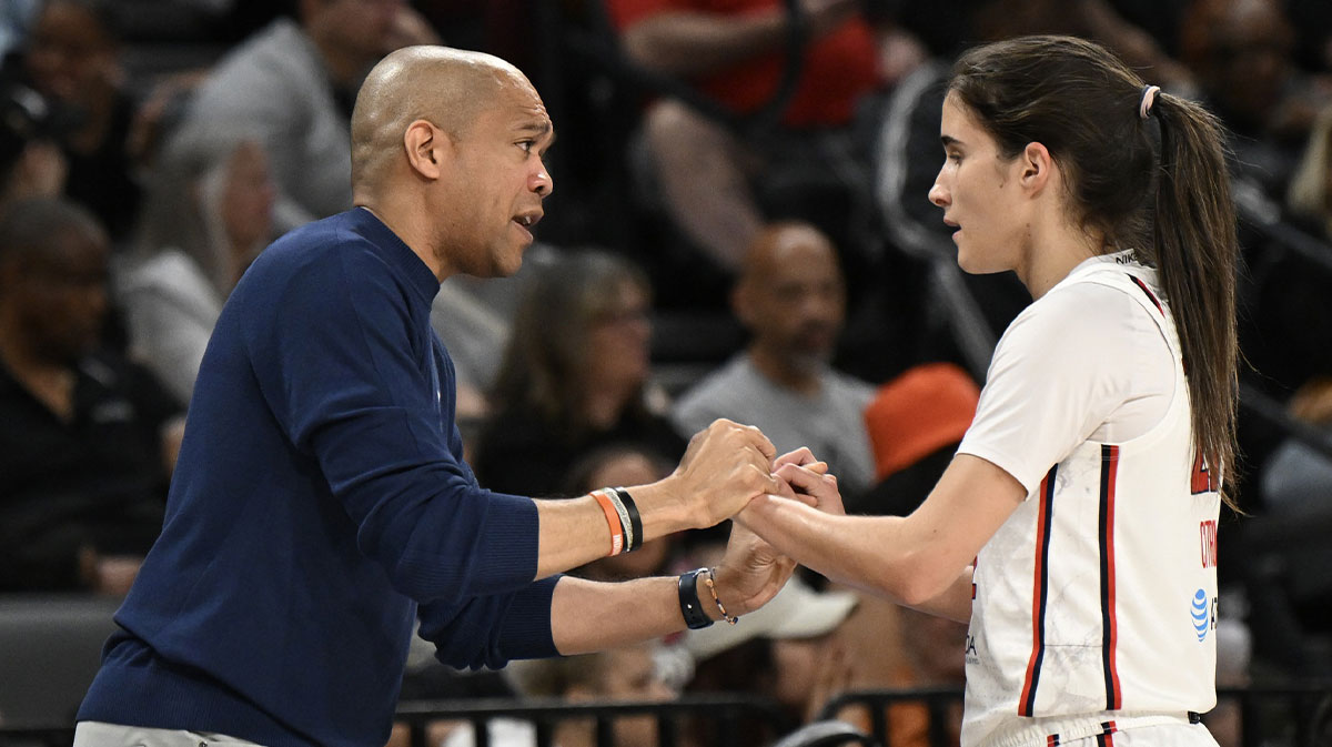 Washington Mystics head coach Sydney Johnson speaks to Washington Mystics guard Sonia Citron (22) in the first quarter of the game against the Las Vegas Aces at Michelob Ultra Arena.