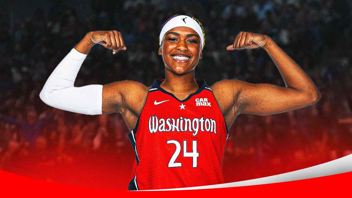 Aaliyah Edwards smiles and flexes biceps in Mystics jersey
