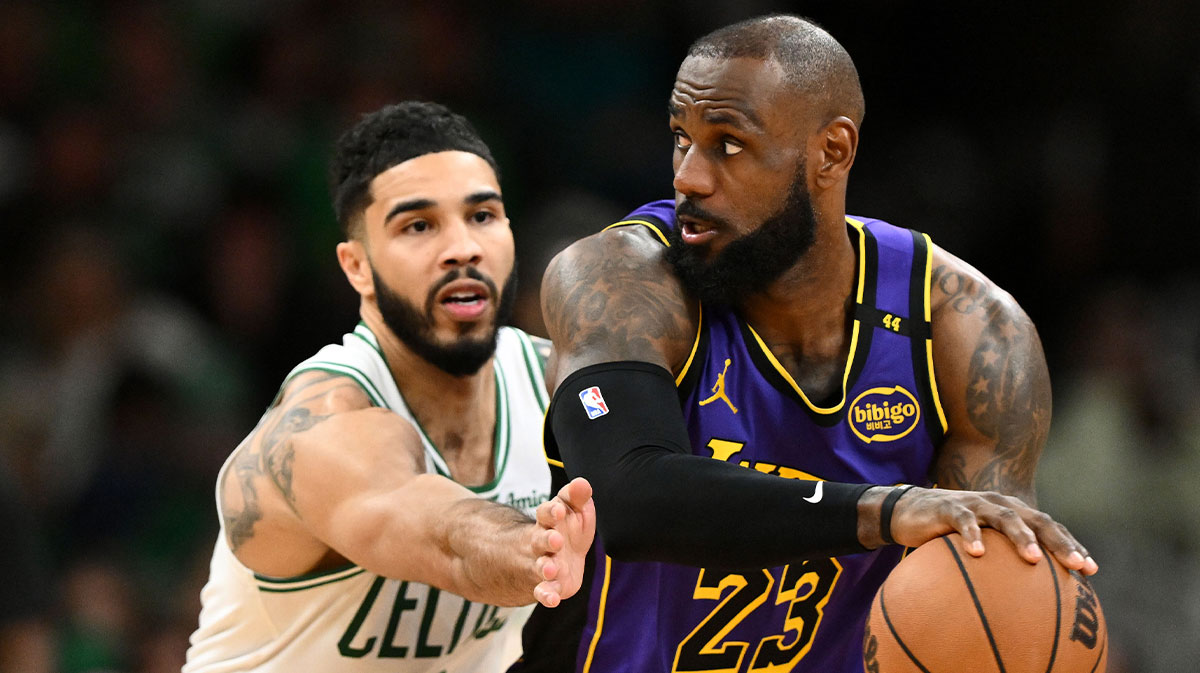 Los Angeles Lakers forward LeBron James (23) controls the ball against Boston Celtics forward Jayson Tatum (0) during the fourth quarter at the TD Garden.