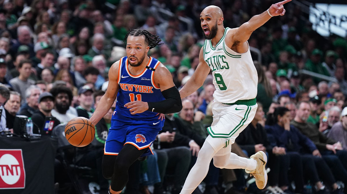 New York Knicks guard Jalen Brunson (11) returns the ball against Boston Celtics guard Derrick White (9) in the second quarter during game one of the second round for the 2025 NBA Playoffs at TD Garden.